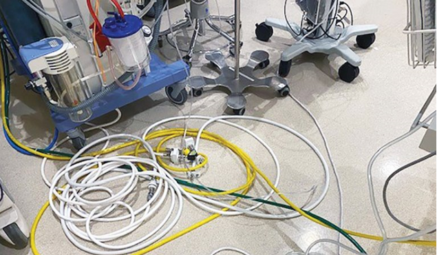 Picture of a tangle of cables on the OR floor