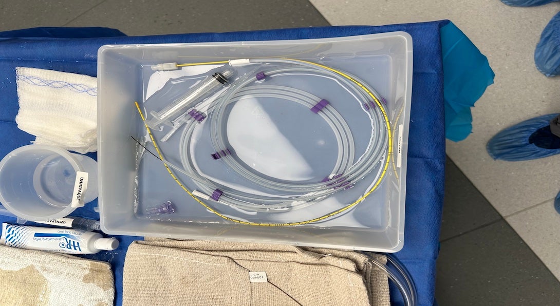 Example of device/wire management. Four different components can be seen here, contained in a saline bin, with little order.